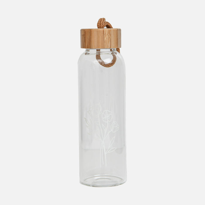 Bouteille d’eau en verre avec fleurs