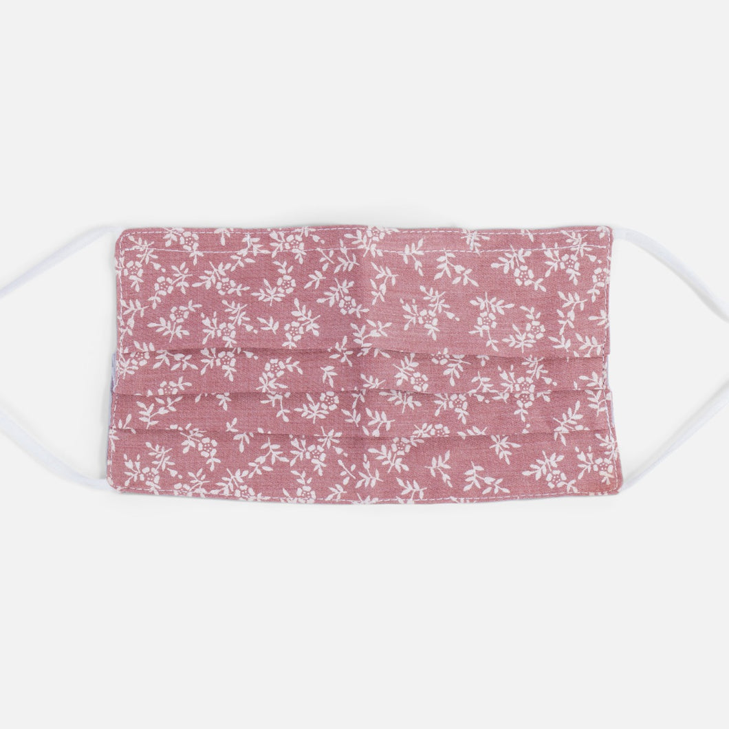 Reusable pink mask with small white flowers
