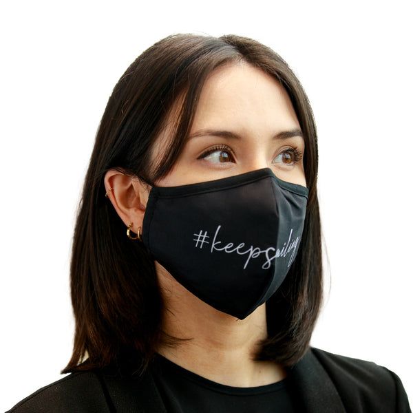 Load image into Gallery viewer, Reusable black mask for women with white quote ‘’#keepsmiling’’
