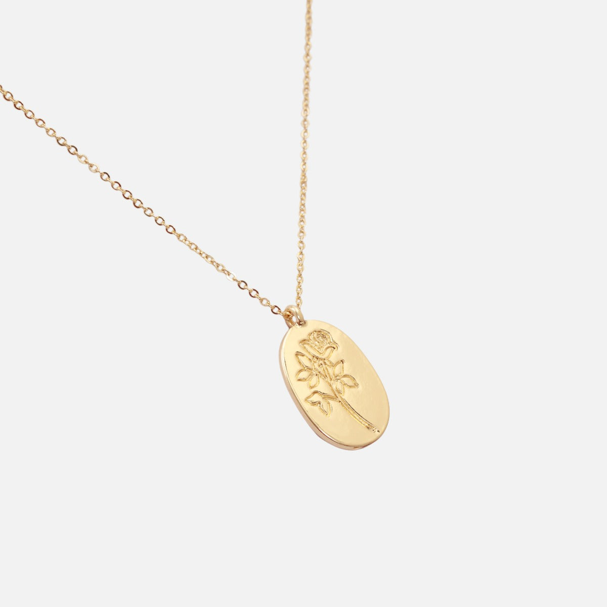 Golden necklace with engraved rose charm