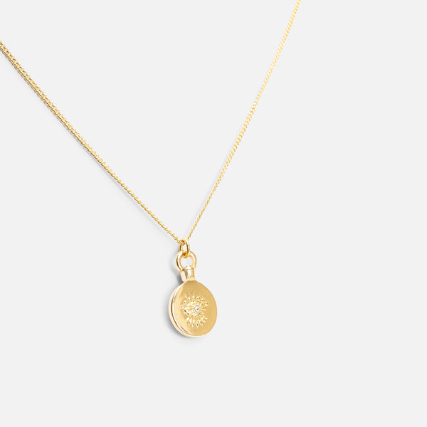 Load image into Gallery viewer, Reversible golden pendant with eye and star medallions
