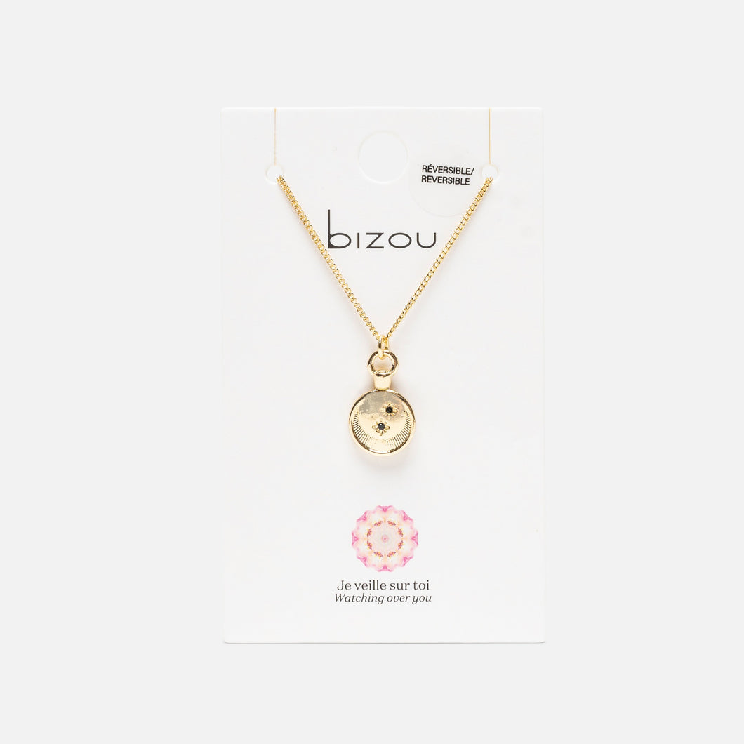 Reversible golden pendant with a night star medallion
