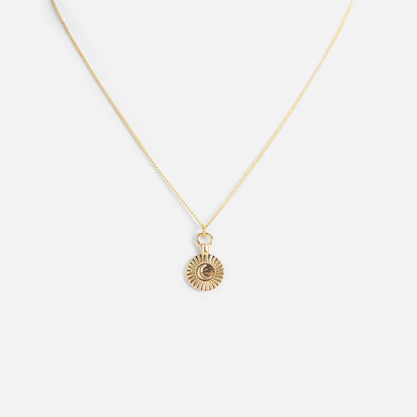 Load image into Gallery viewer, Reversible golden pendant with a night star medallion
