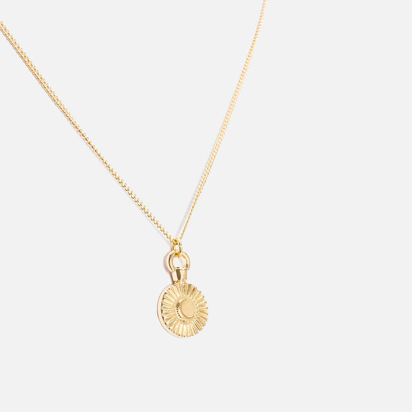 Load image into Gallery viewer, Reversible golden pendant with a night star medallion
