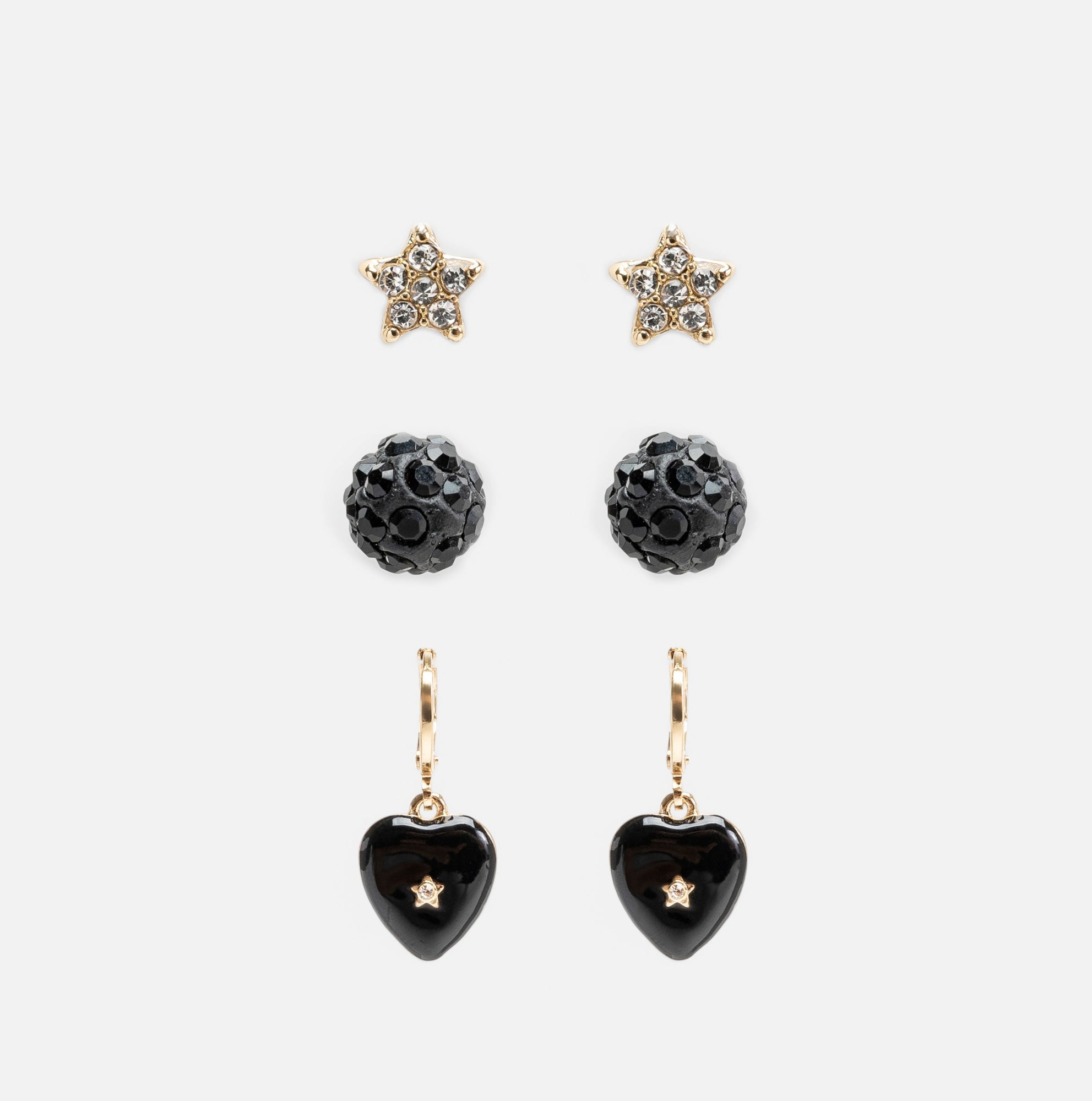 Trio de boucles d’oreilles étoiles, boules et cœurs noirs