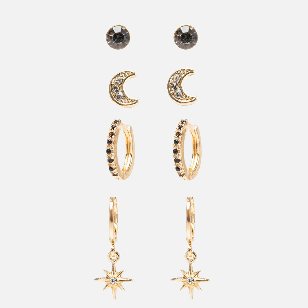 Set of golden fixed earrings and hoops with black details, moons and stars