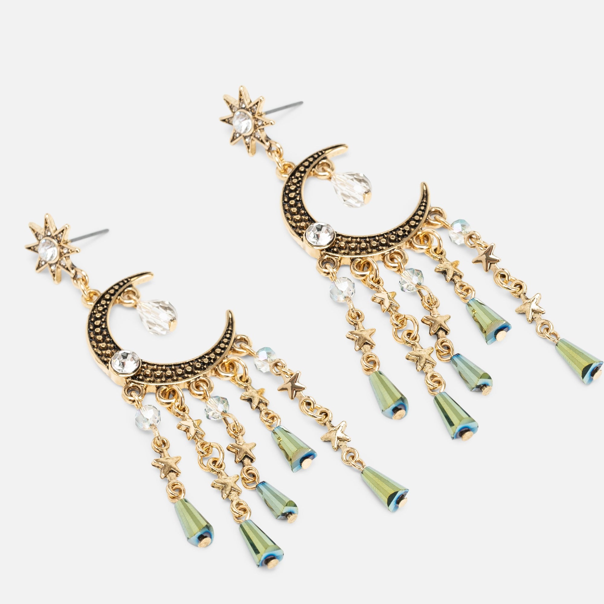 Long golden earrings with moon and star charms and multiple beads
