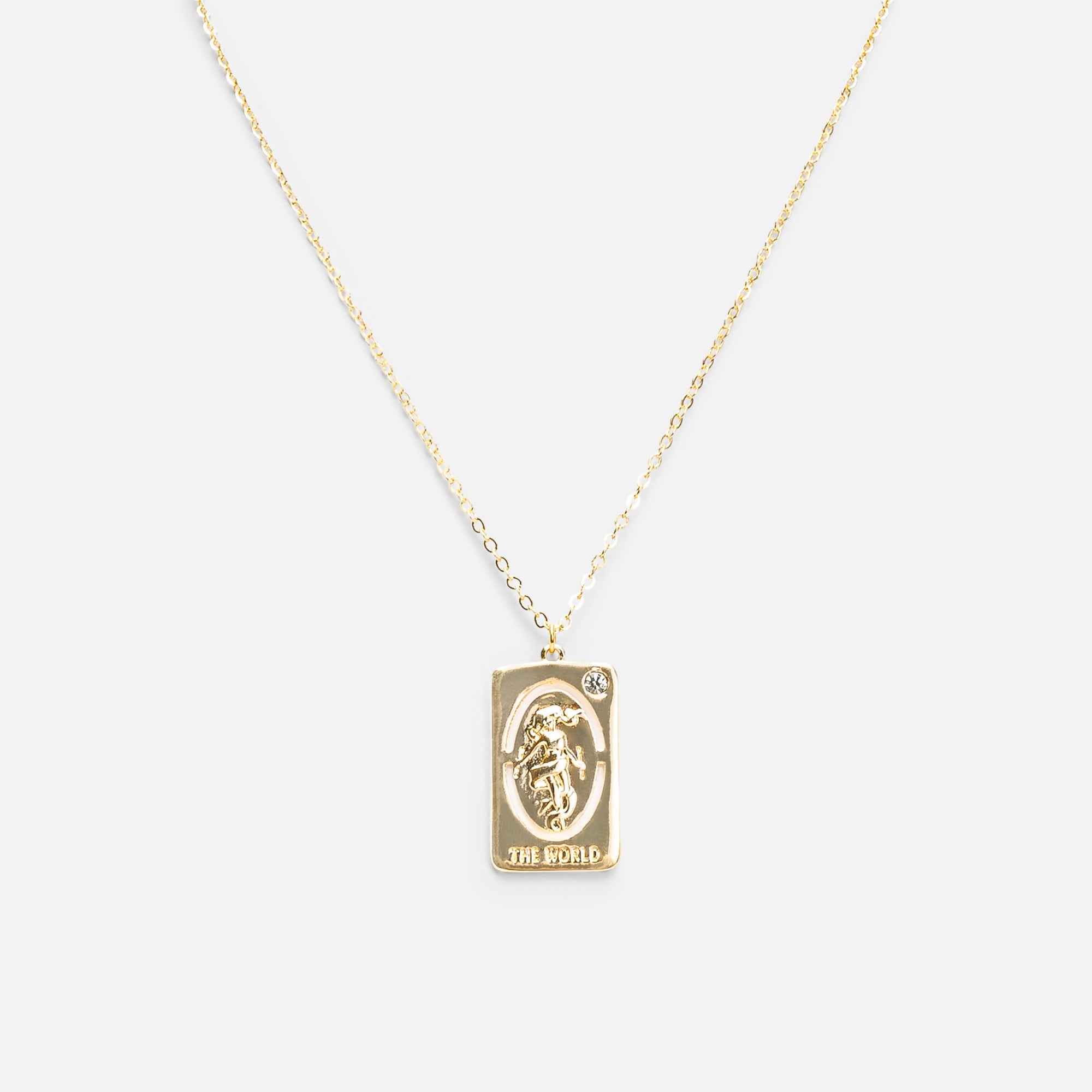 Golden pendant with world tarot card