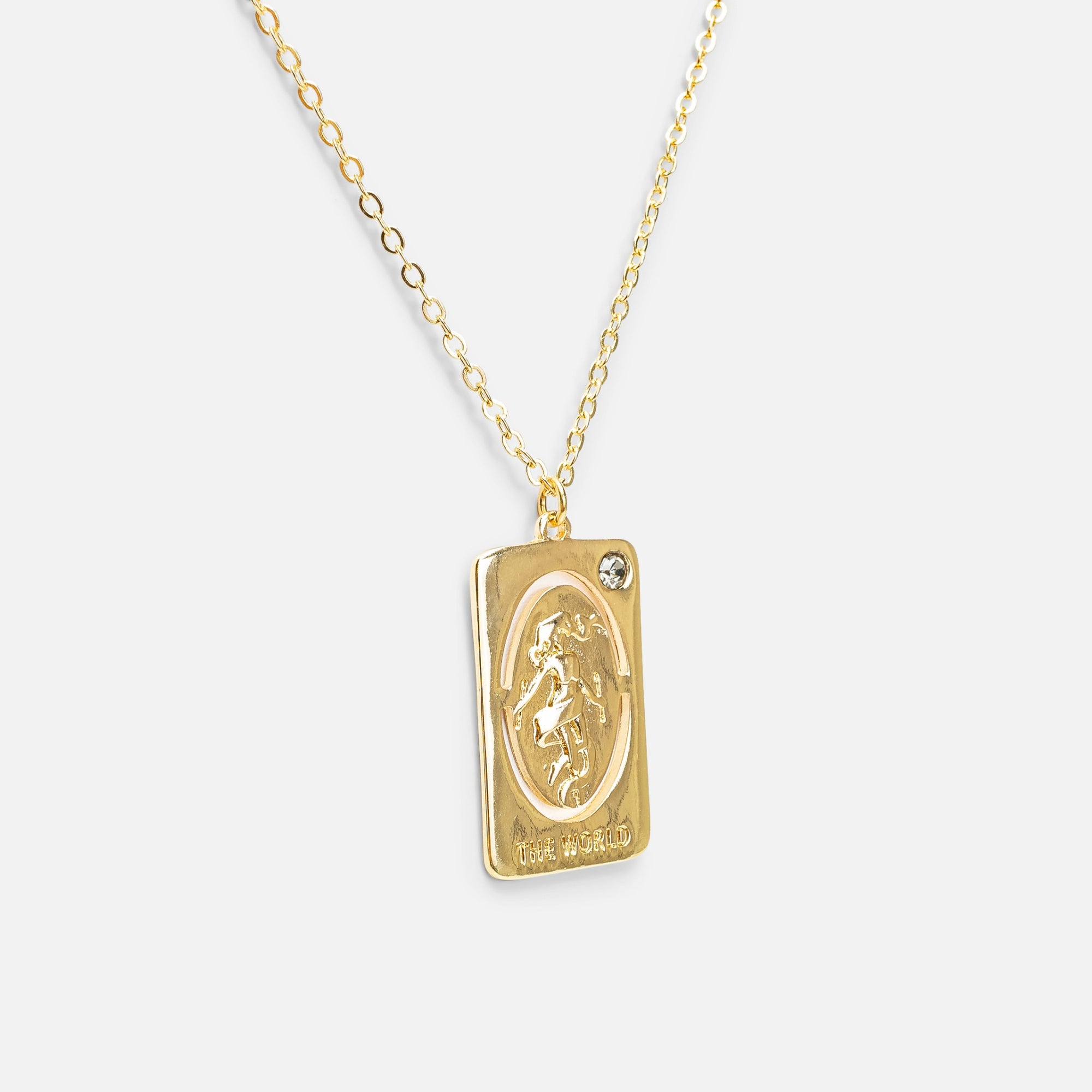 Golden pendant with world tarot card