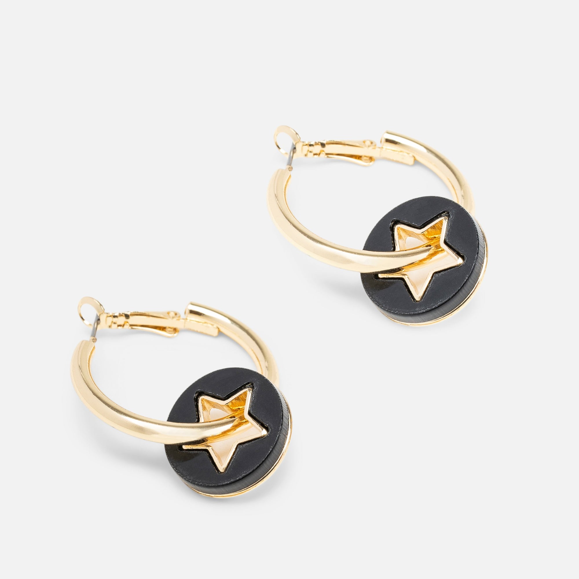 Hoop earrings with horn and star charms