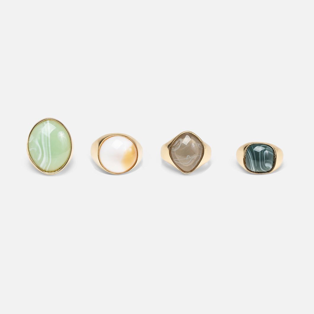 Set of four golden rings with massive stones