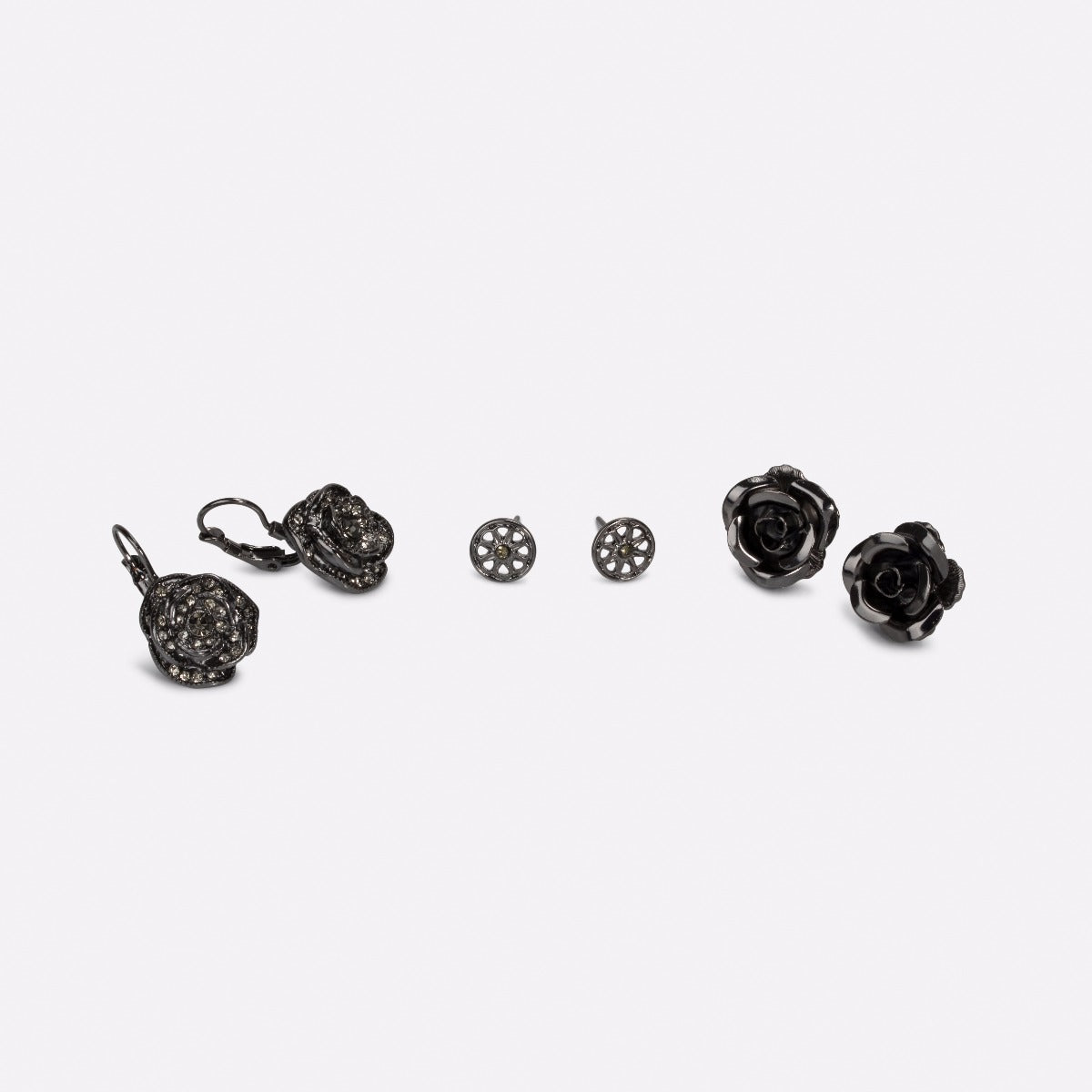 Three pairs of black earrings in bloom   