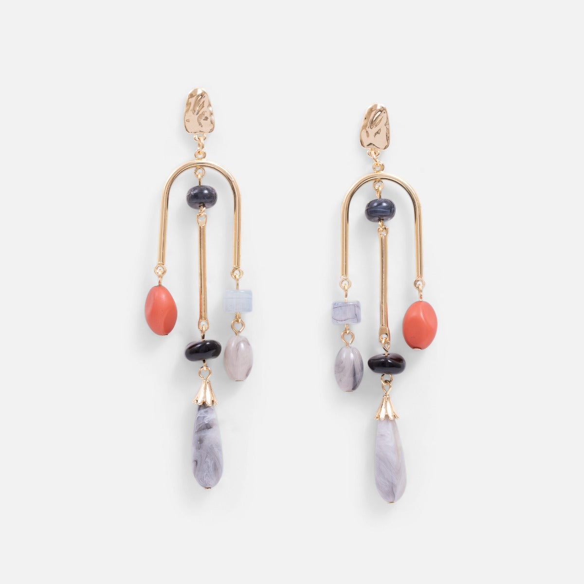 Long golden earrings with small natural stones effect