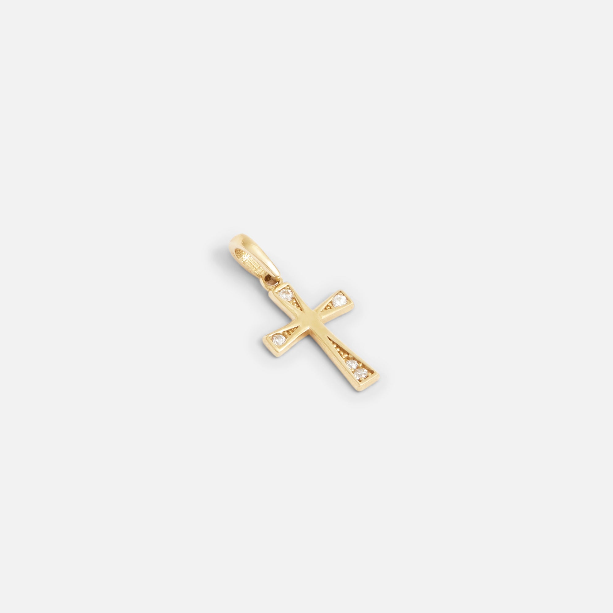 10k yellow gold cross charm with stones at the ends 