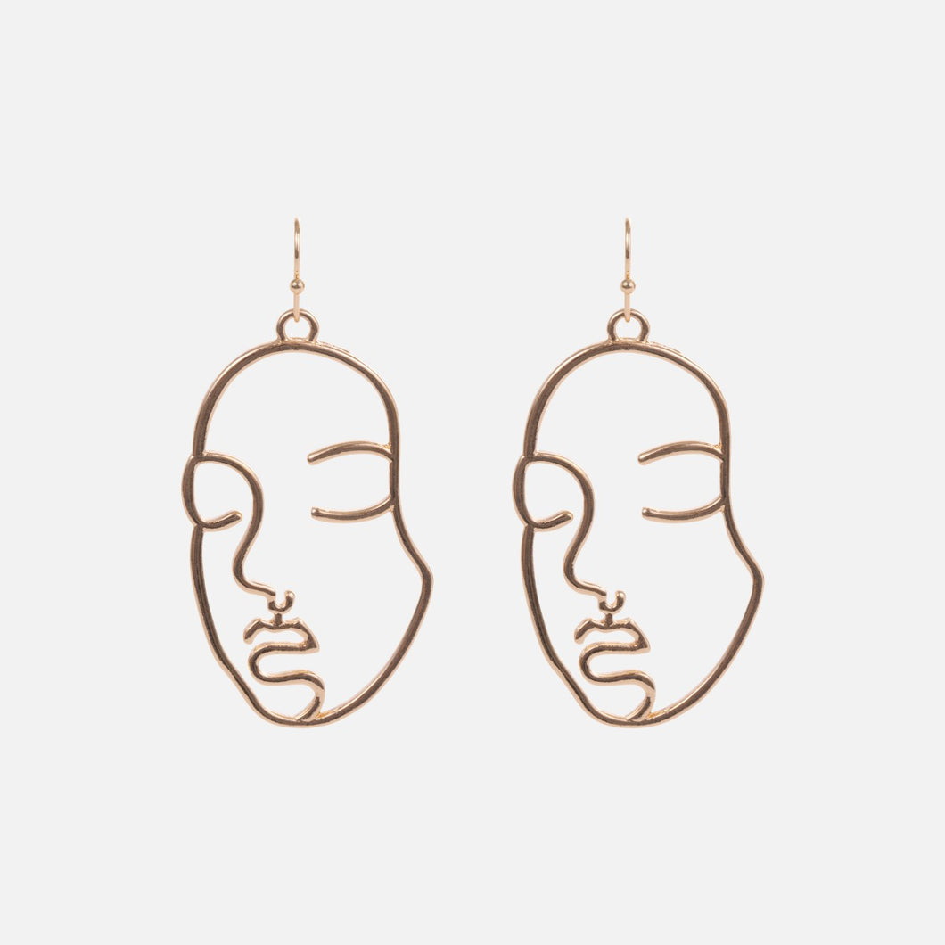Golden woman face earrings