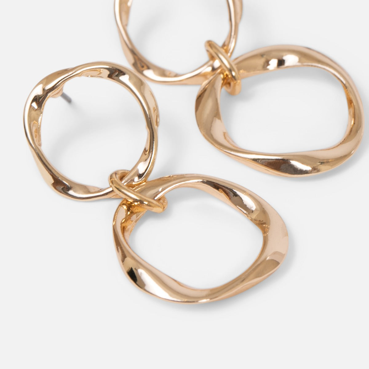 Golden earrings with two wavy hoops   