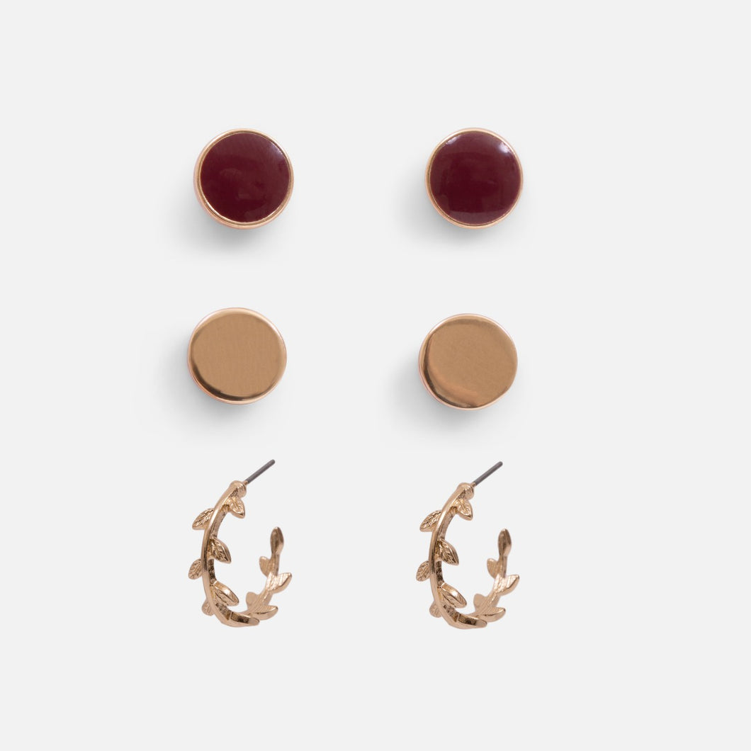 Set of three golden earrings with hoops and two burgundy and golden circles
