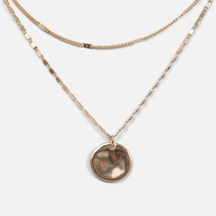 Collier doré double chaîne avec médaillon martelé