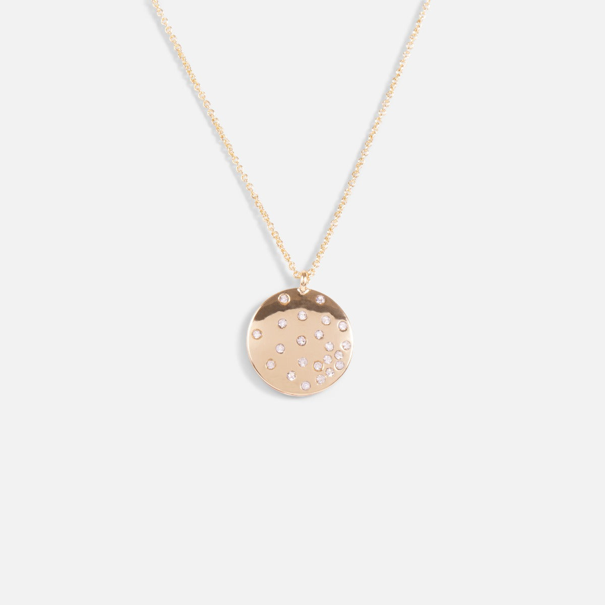 Golden pendant with small sparkling stars medallion