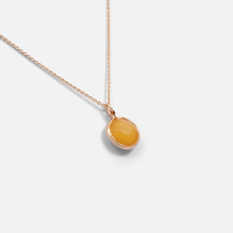 Golden pendant with yellow quartz effect charm