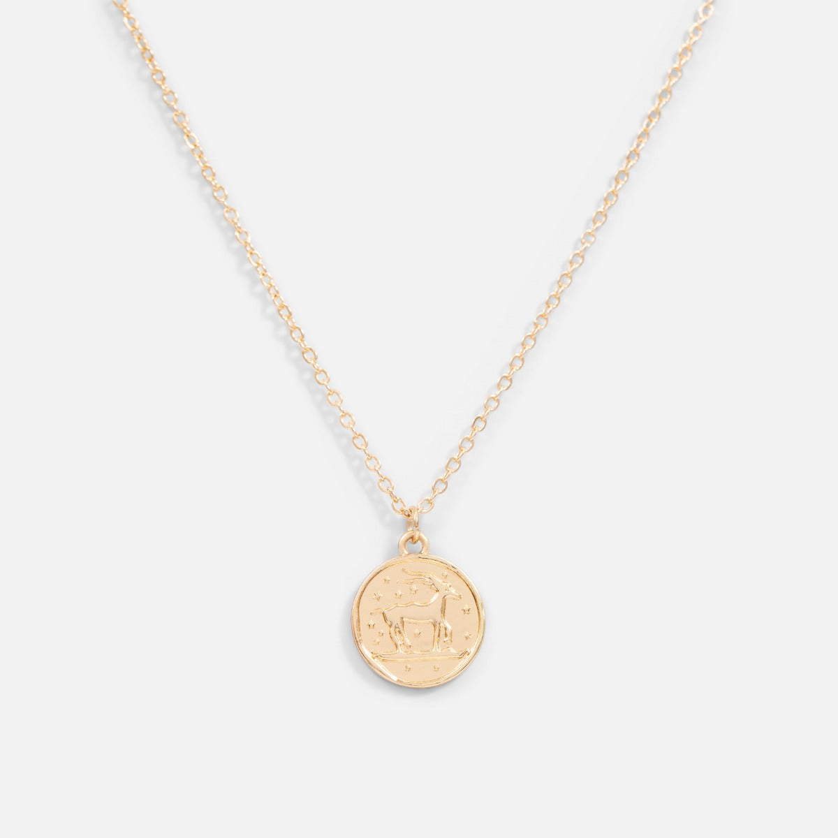 Golden pendant astrological sign " capricorn "