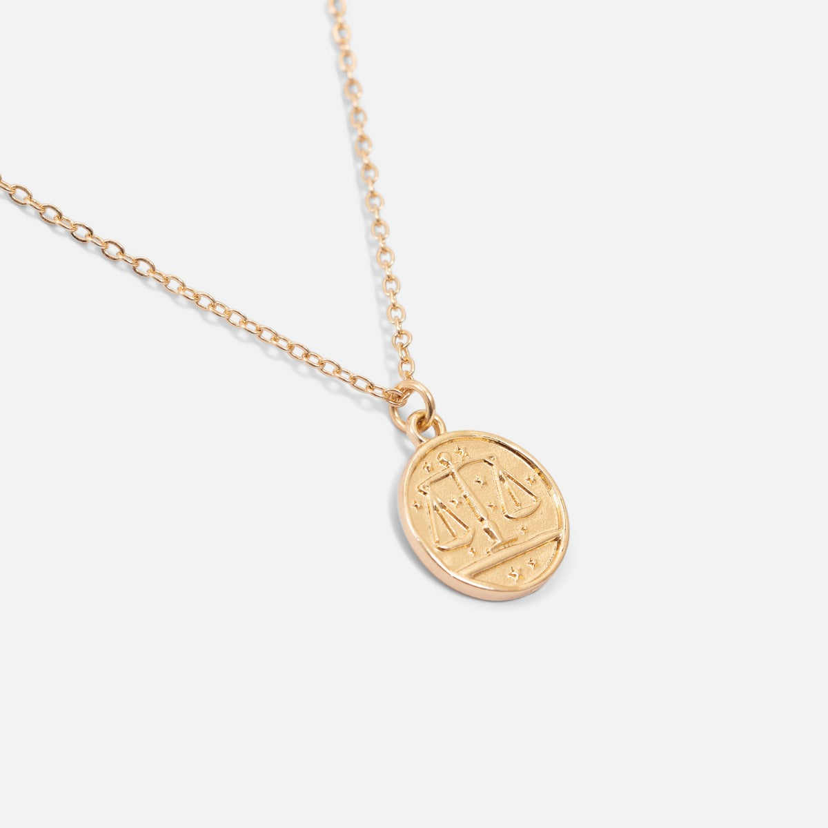 Golden pendant astrological sign "libra"