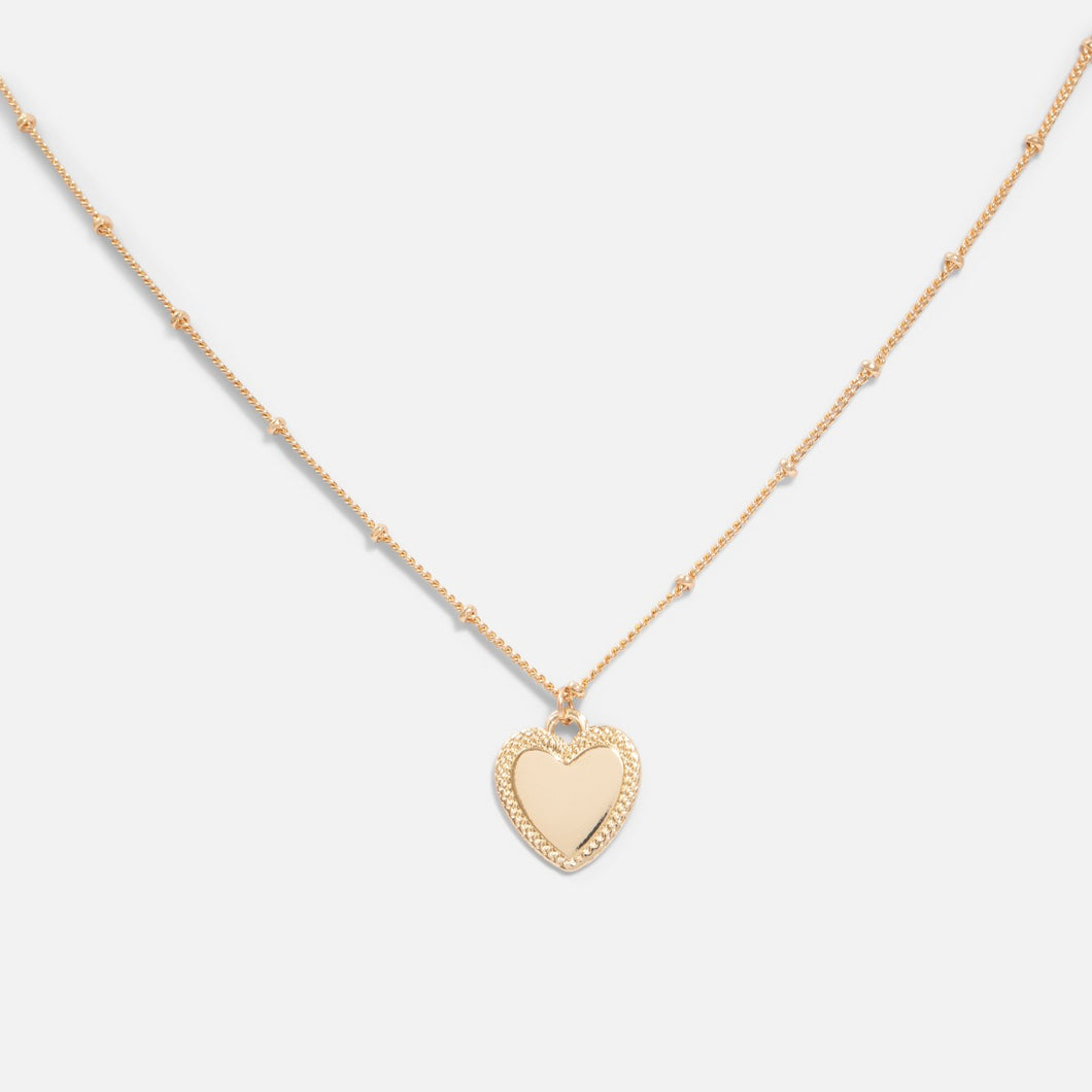 Golden pendant with small heart charm