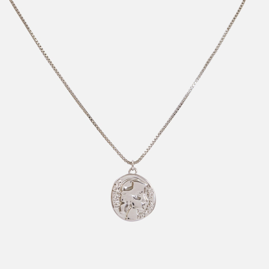 Silver pendant with old coin charm