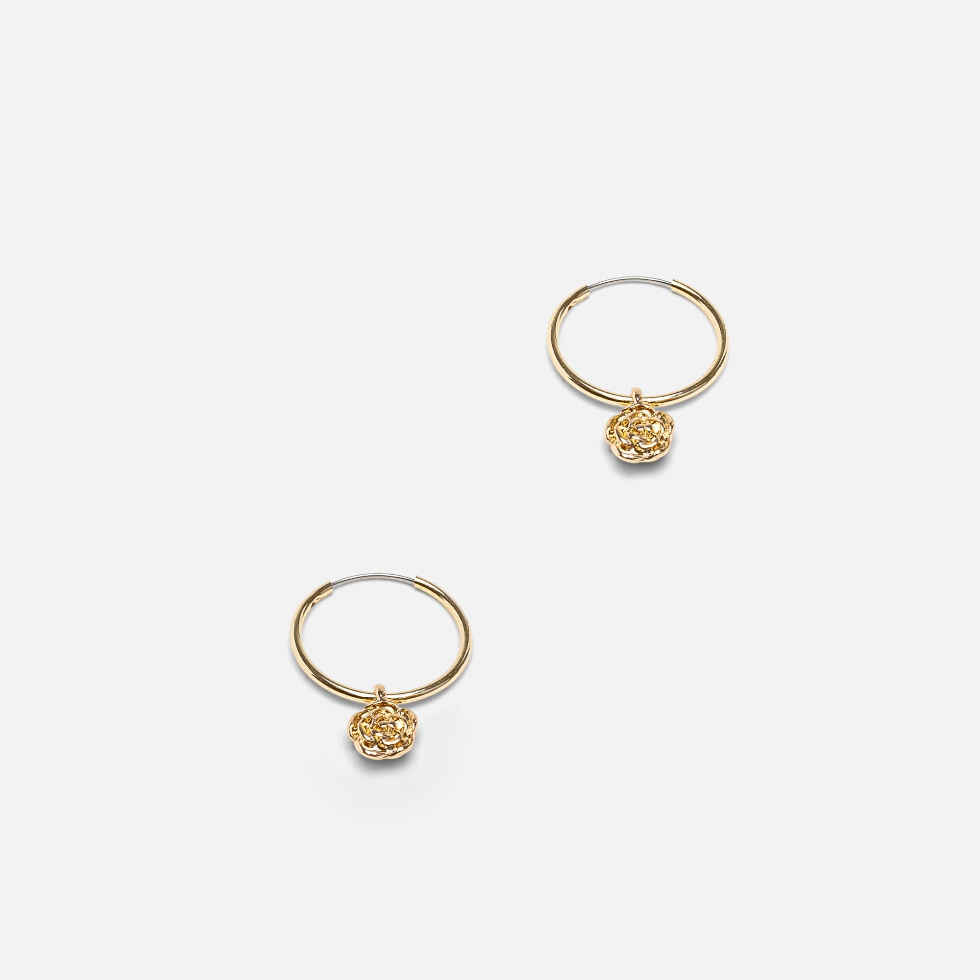 Set of three golden fixed earrings and hoops with flower charm