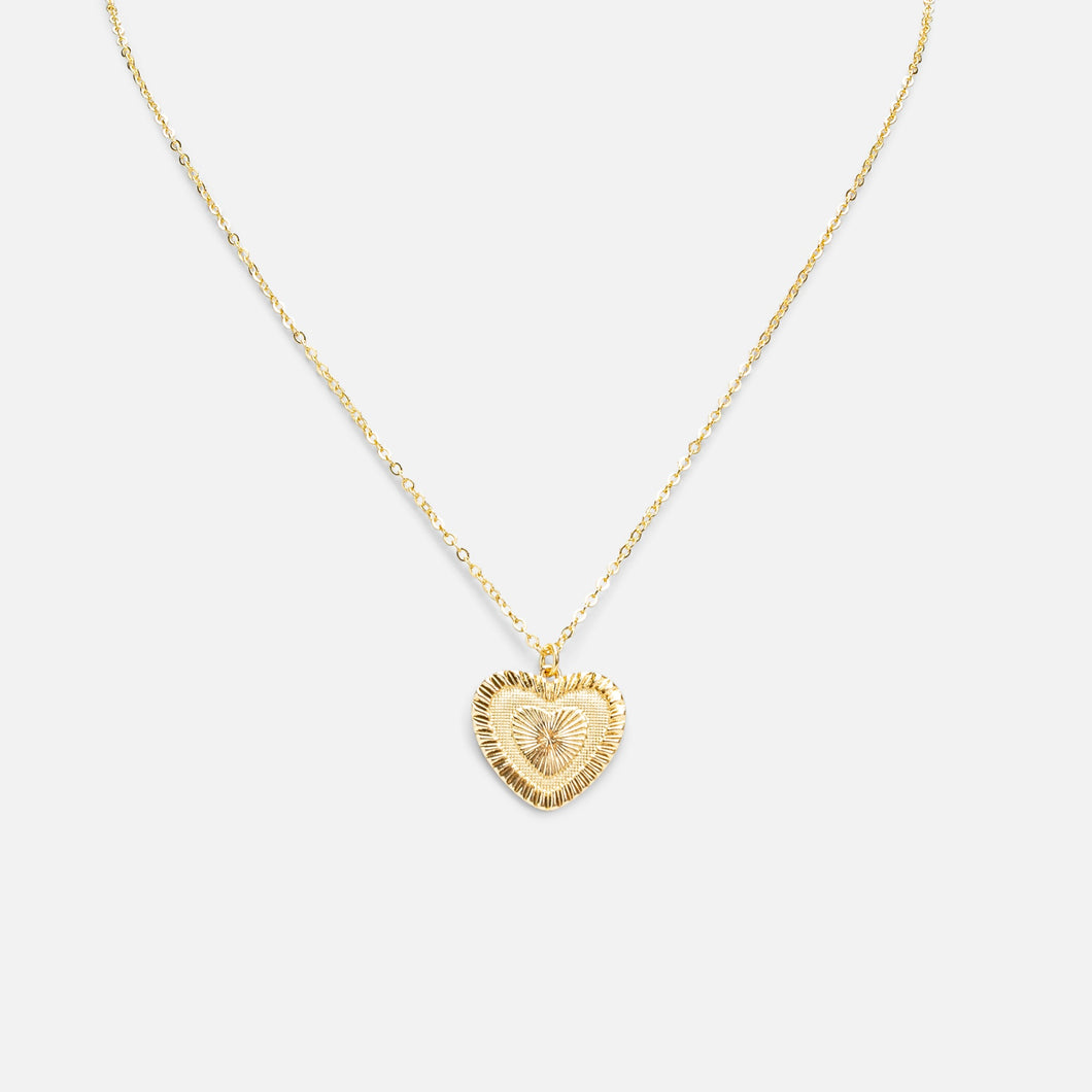 Golden necklace with heart shaped pendant