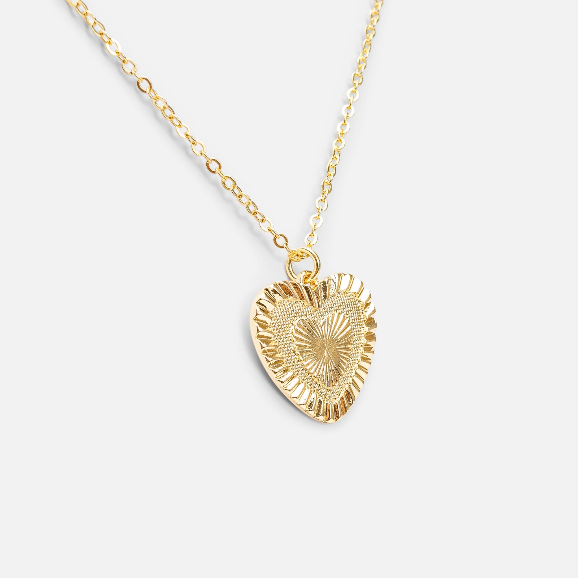 Golden necklace with heart shaped pendant