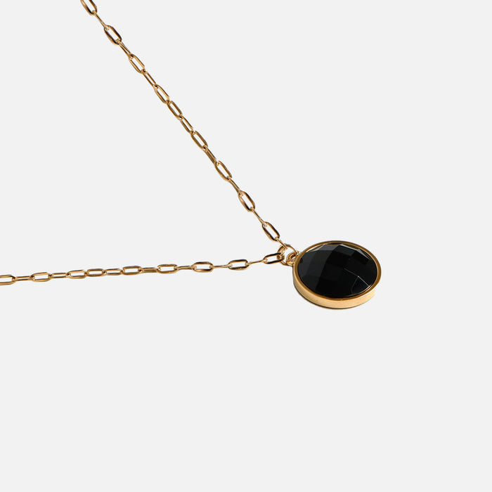 Collier doré pierre circulaire noire