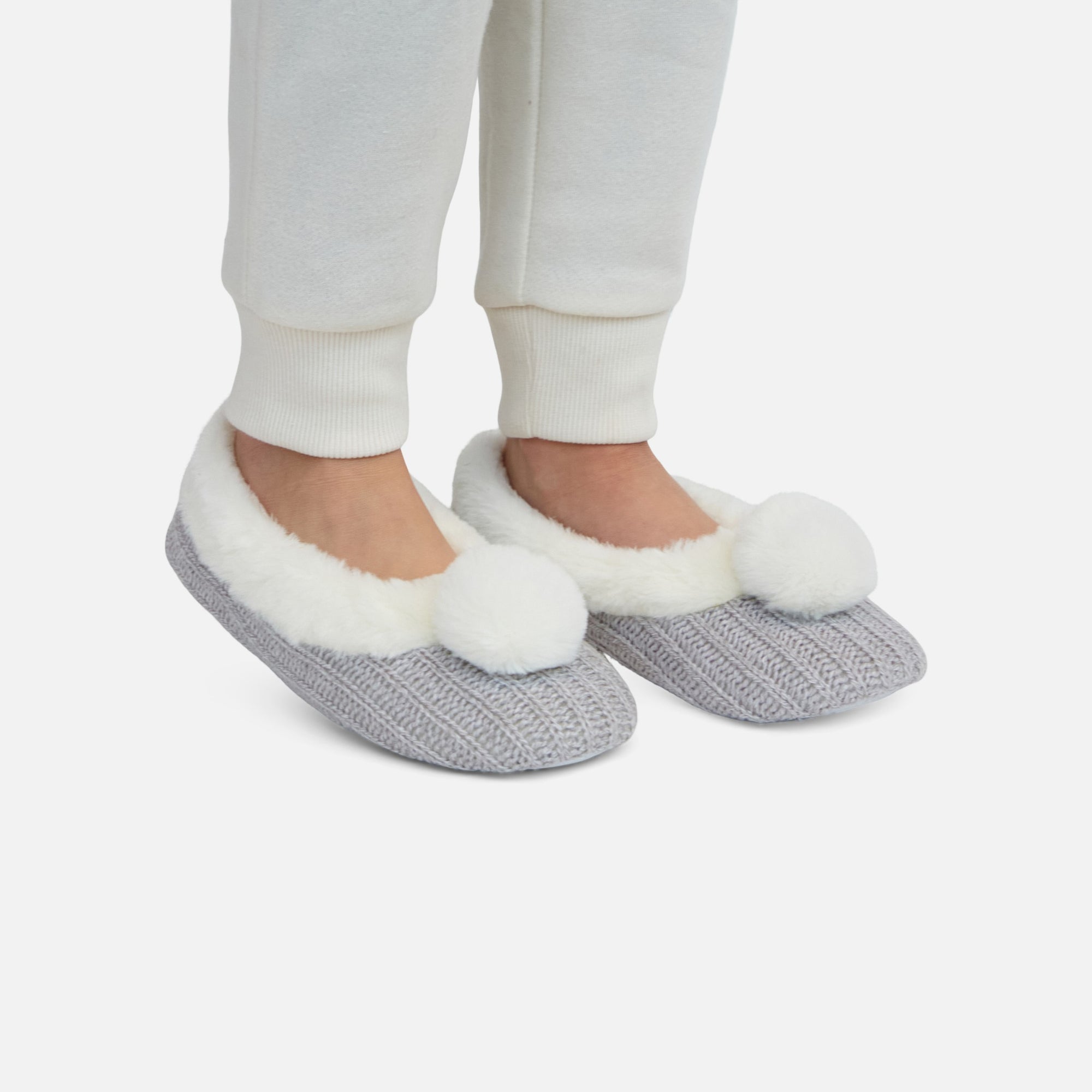 Grey slippers with beige pompoms