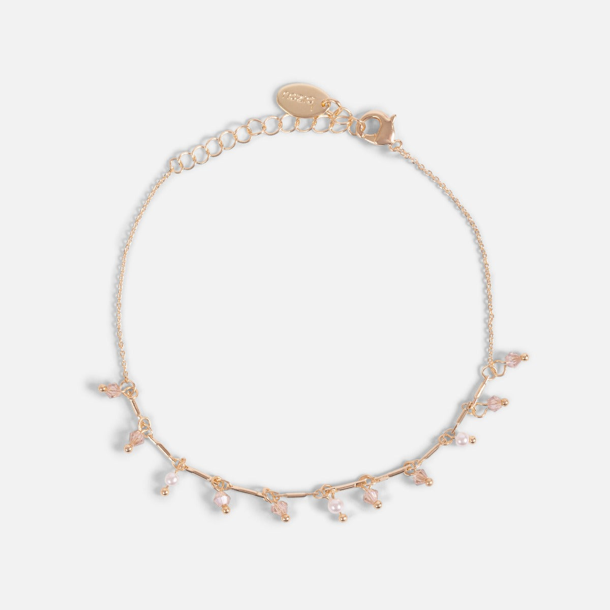 Délicate chaîne de cheville dorée avec petites perles