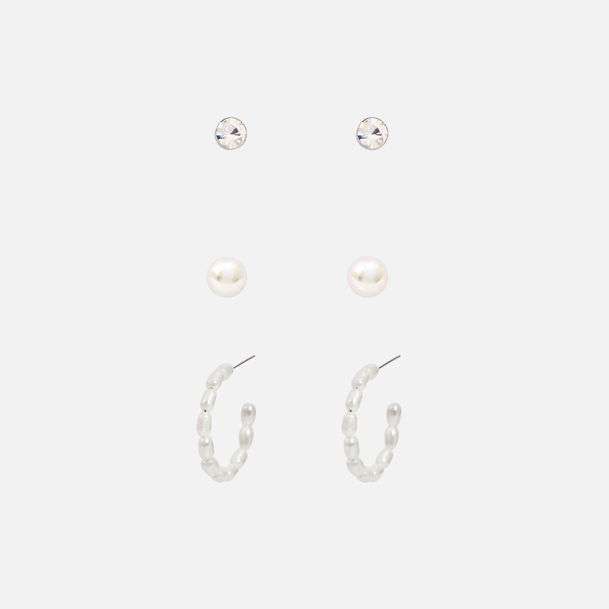 Set of three silvered earrings fixed and hoops with pearls