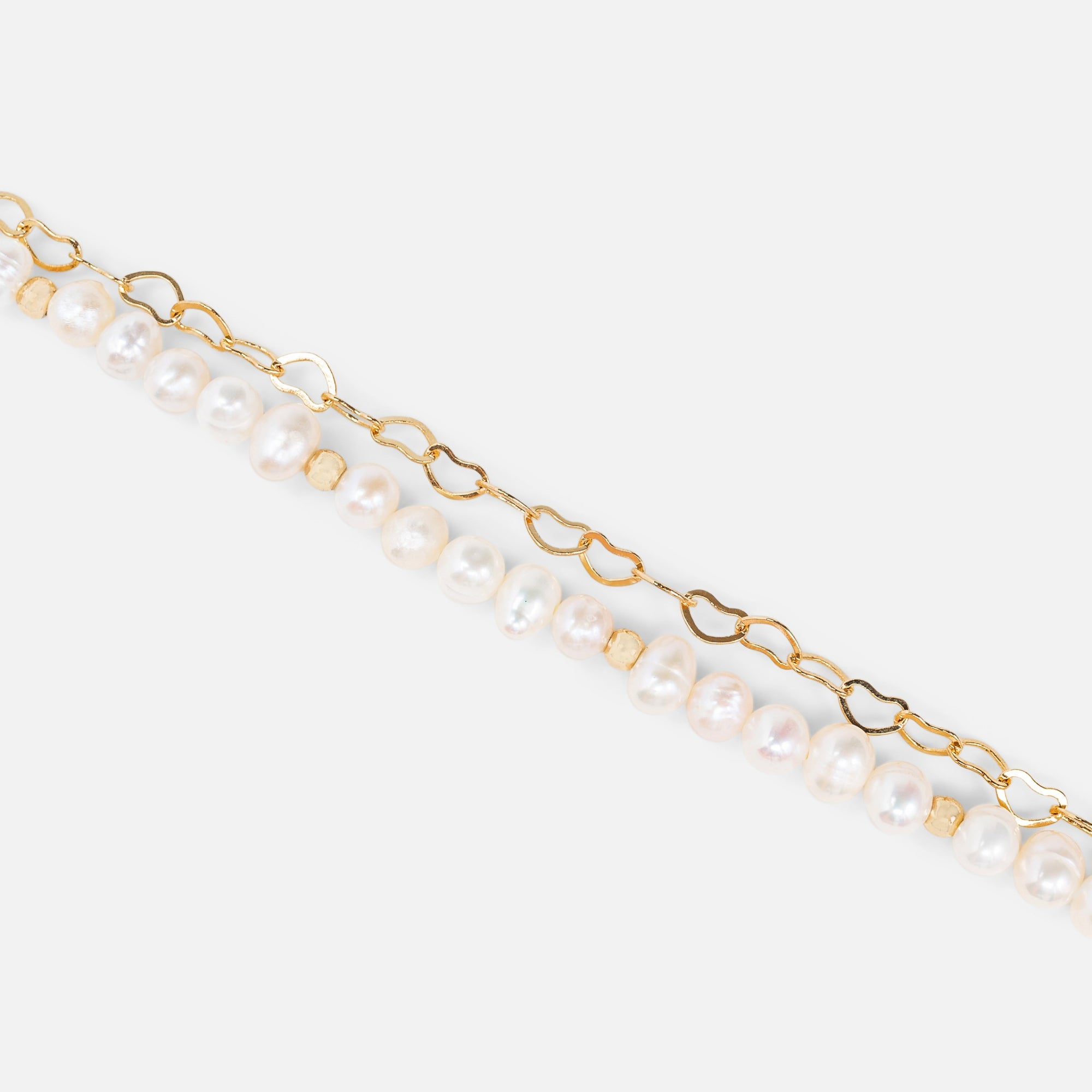 Golden bracelet with heart and pearl chains 