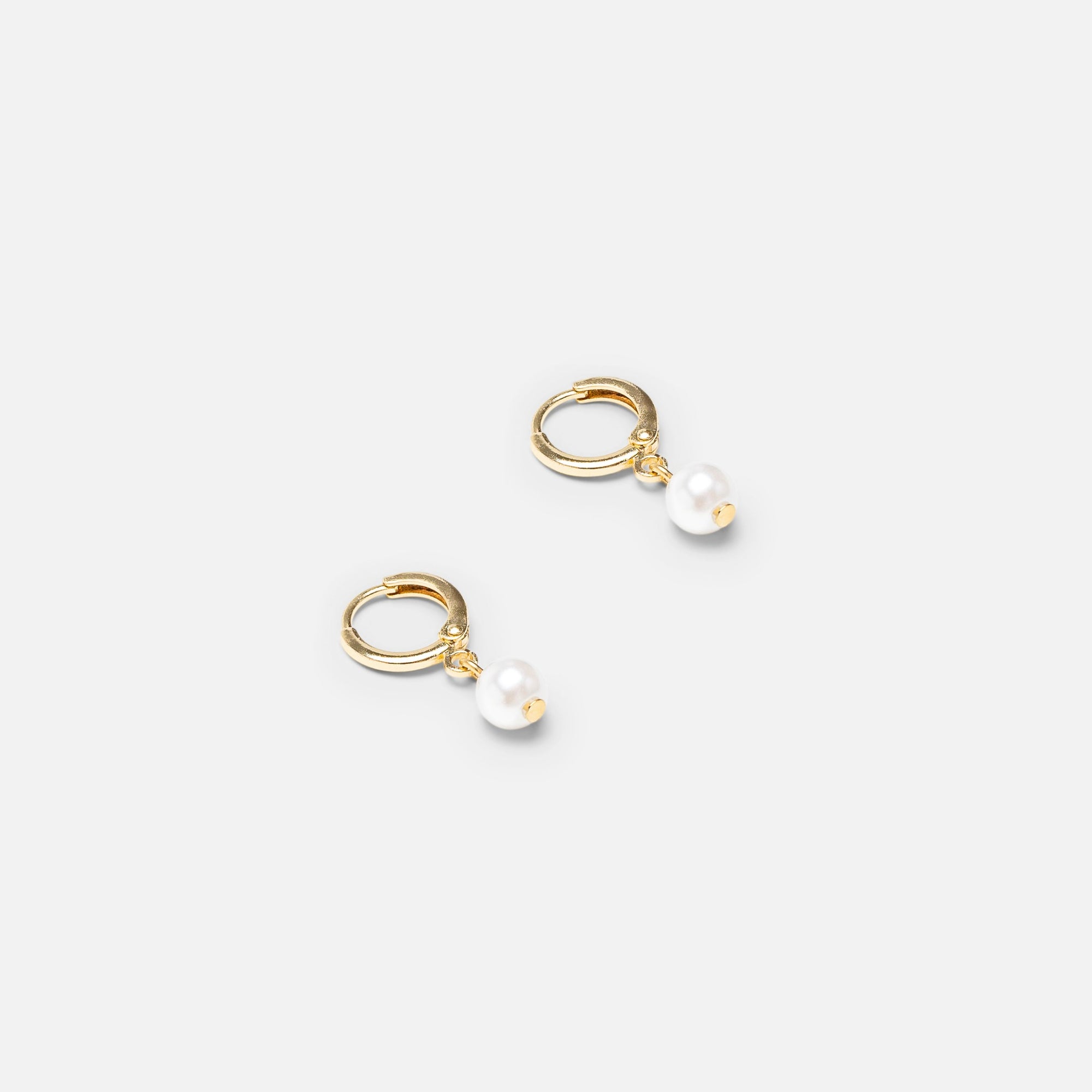Set of pearl, circle and hoop earrings with pearl charm