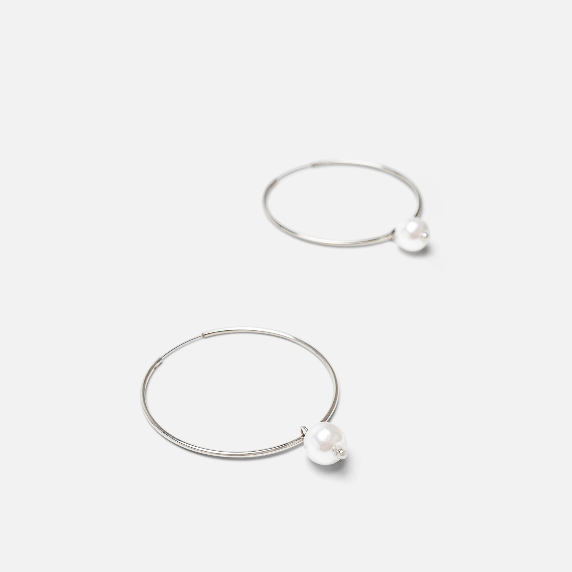 Silver hoop earrings with pearl charm 