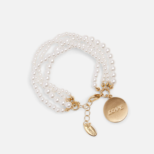 Load image into Gallery viewer, White pearl bracelet with four rows of pearls and a love charm
