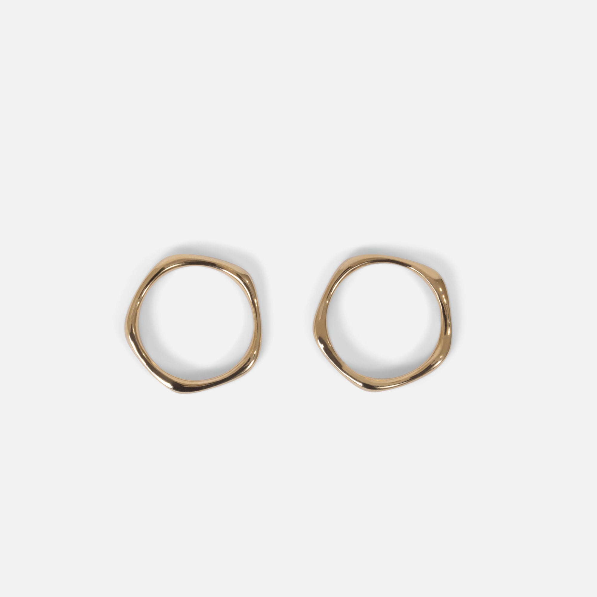 Duo of simple golden rings in stainless steel