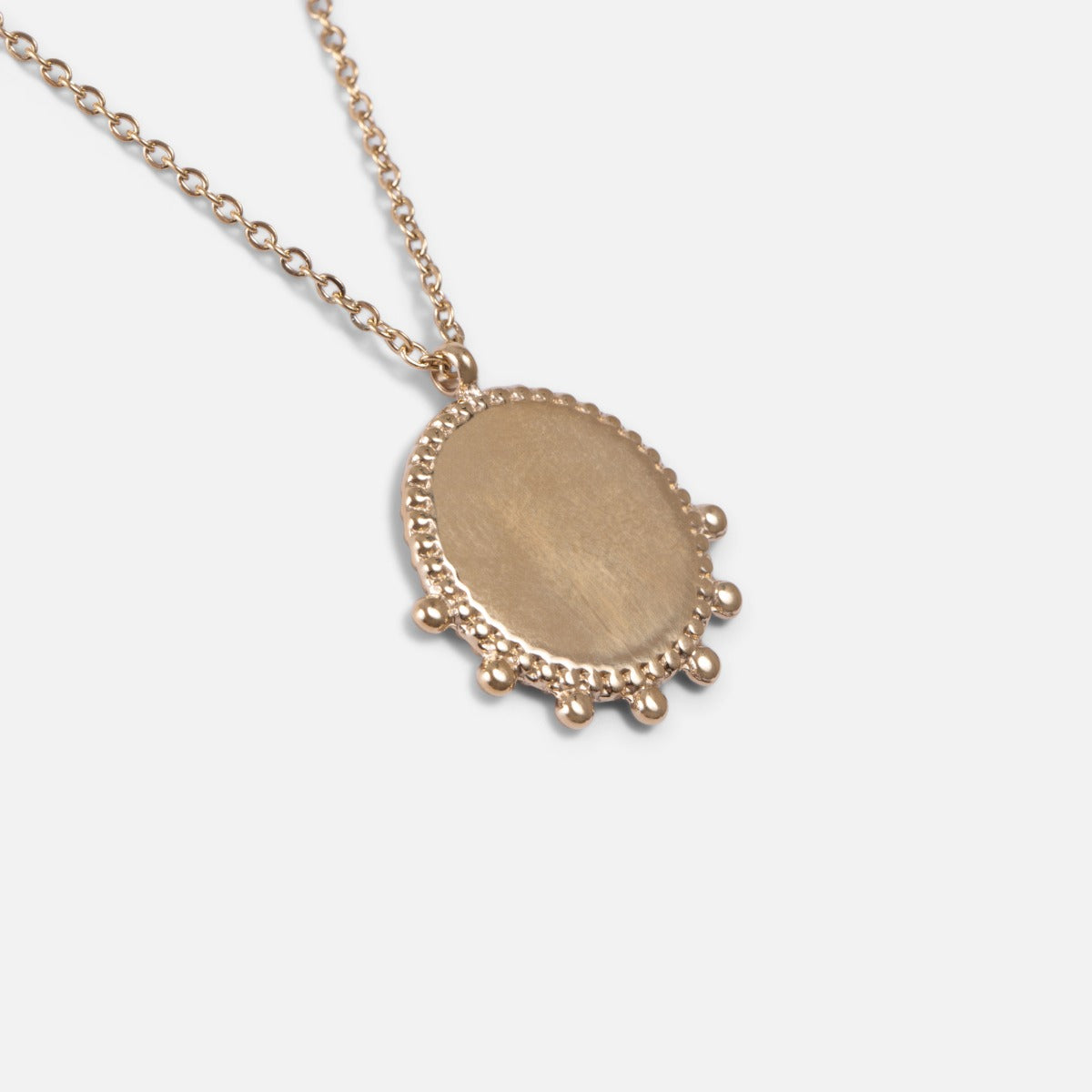 Golden stainless steel necklace with original circular medallion