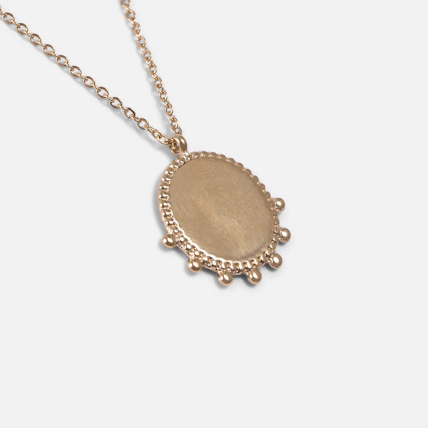 Load image into Gallery viewer, Golden stainless steel necklace with original circular medallion
