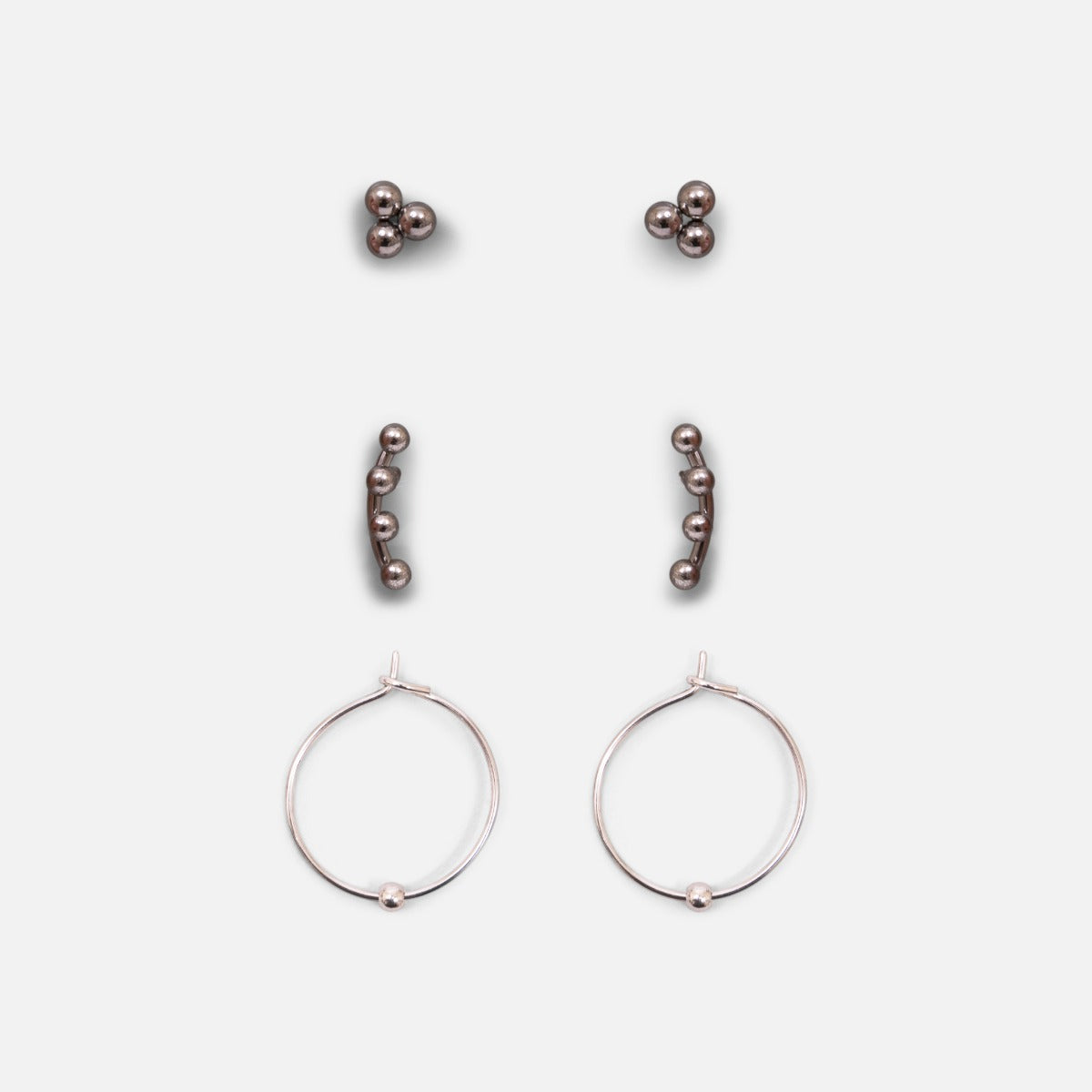 Set of three silver stainless steel stud earrings with hoops and beads