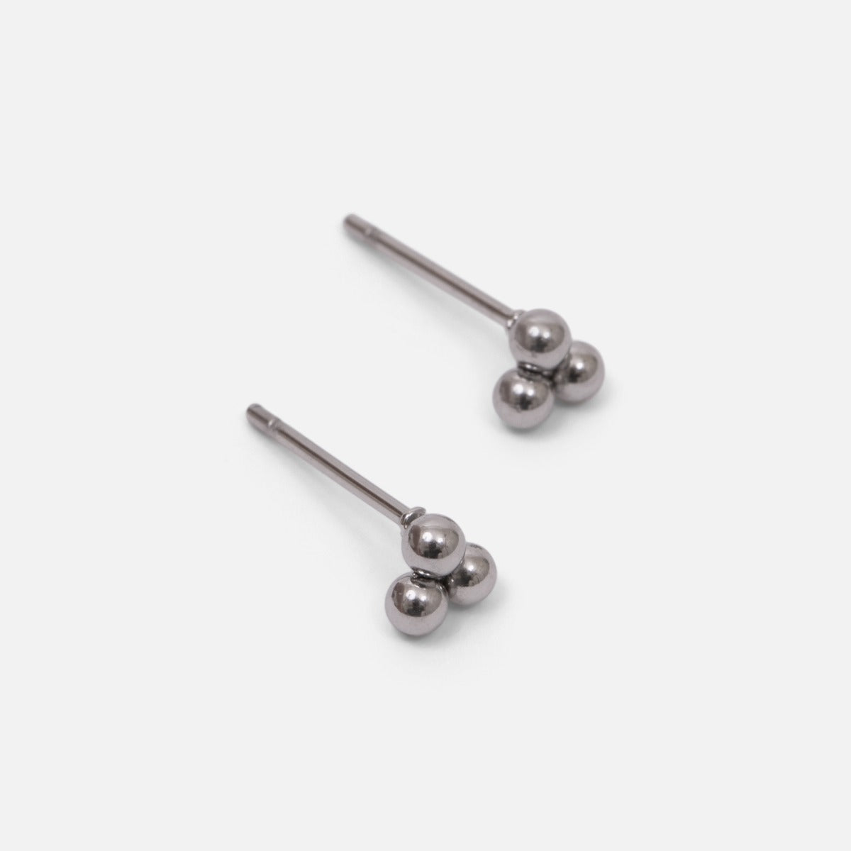 Set of three silver stainless steel stud earrings with hoops and beads