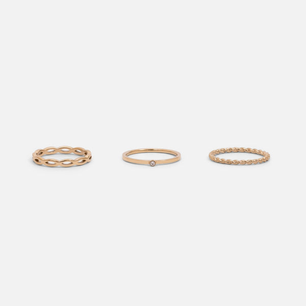 Load image into Gallery viewer, Set of three golden stainless steel wave, twist and zirconium rings 
