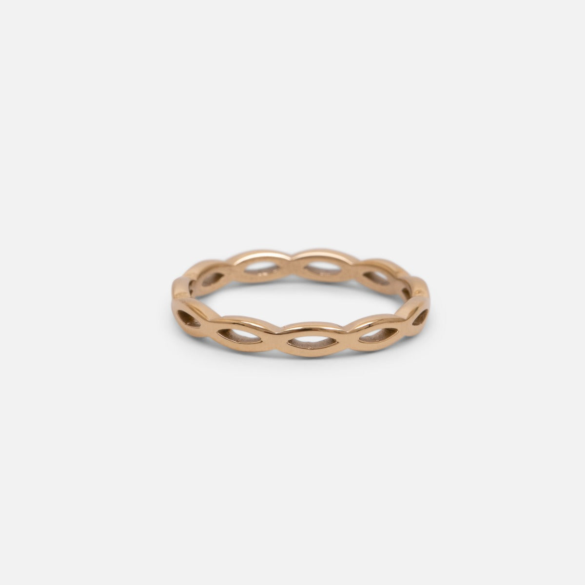 Set of three golden stainless steel wave, twist and zirconium rings 