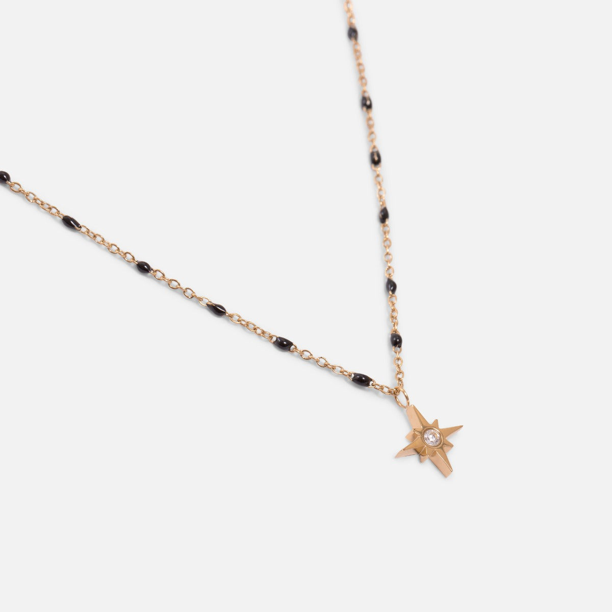 Golden necklace with black beads and star charm in stainless steel