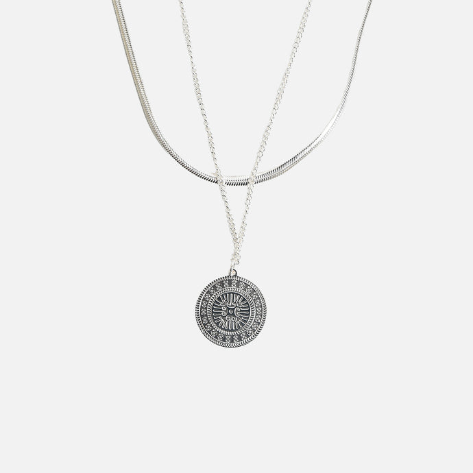 Stainless steel pendant with medallion