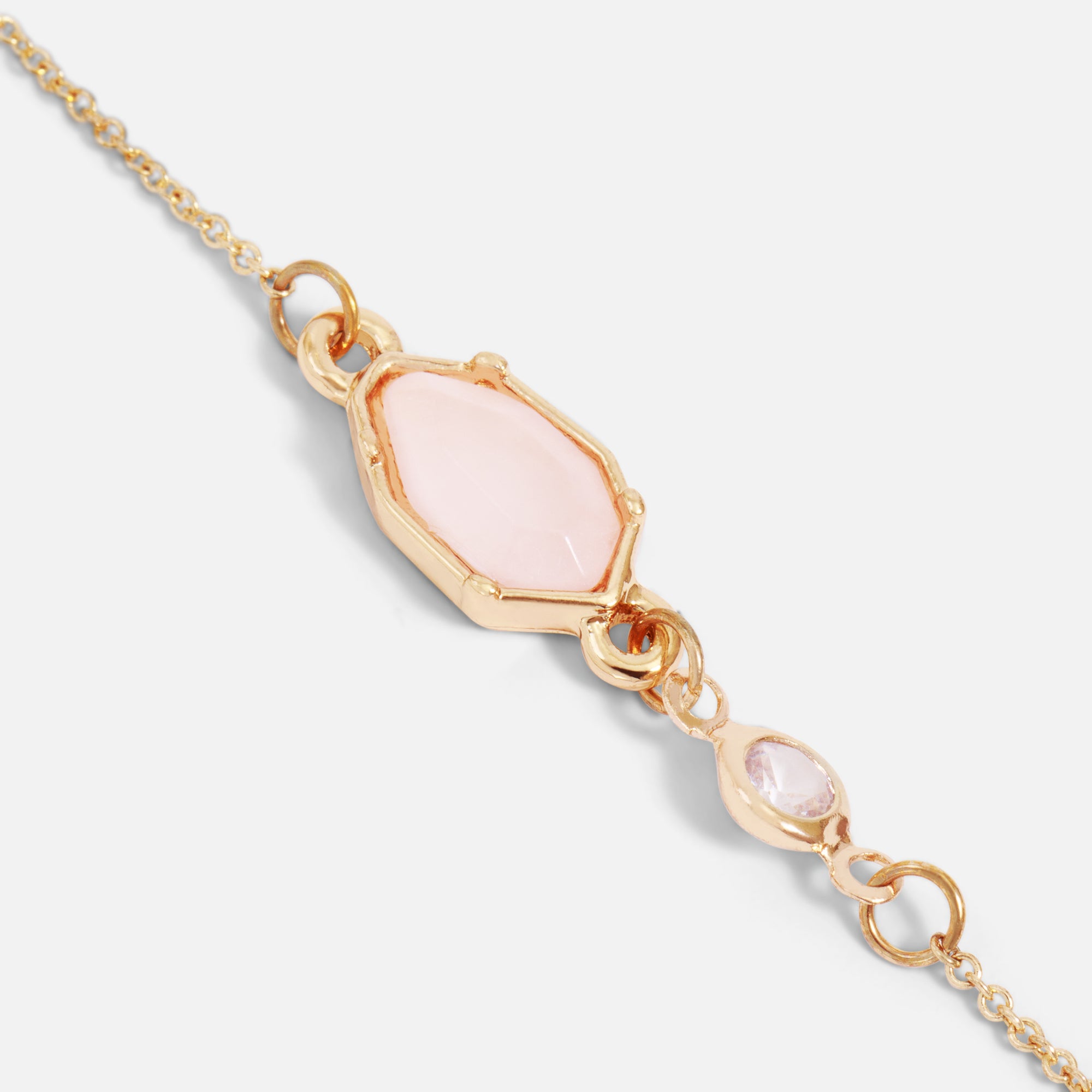 Golden bracelet with pale pink and sparkling stone