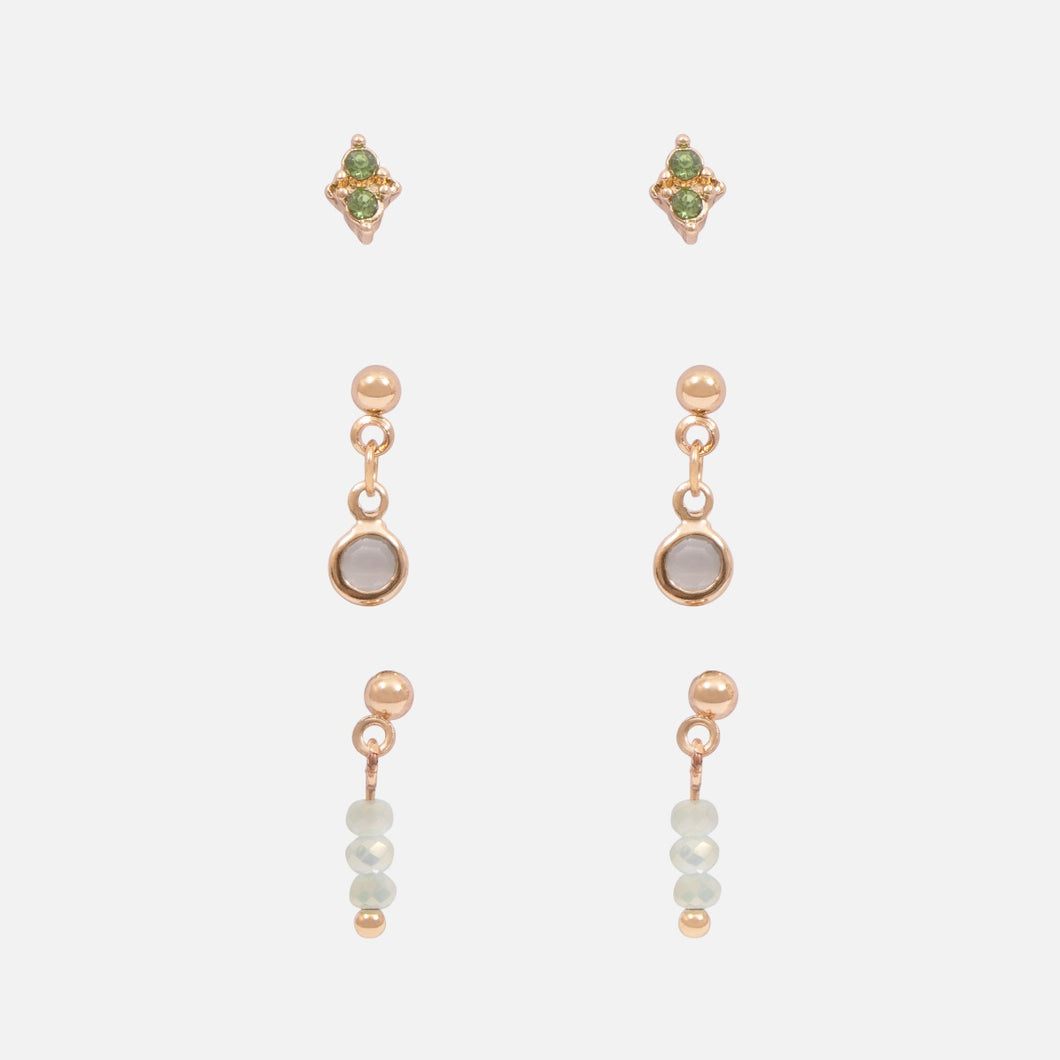 Trio of golden earrings with green stones